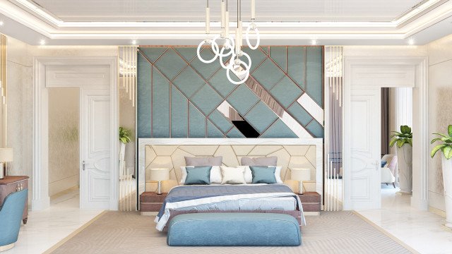 A modern bedroom featuring an ornate bed frame, embroidered duvet and pillows, and a luxuriously tufted velvet armchair.