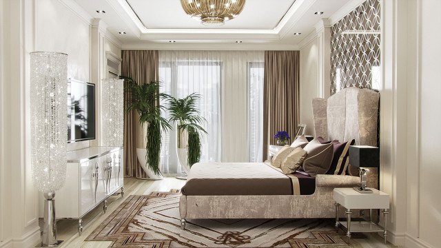 Modern luxury living room with high contrast elegant furnishings, including white sofas matched with black side tables and an ornate crystal chandelier.