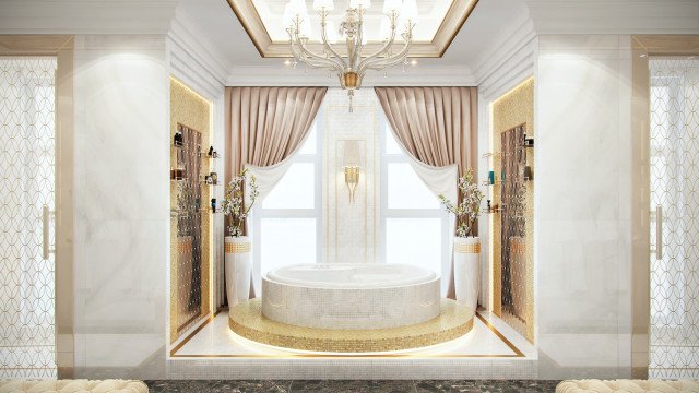 This picture shows a luxurious, modern-style living room with a grand double-sided staircase. The walls and ceilings are covered with a detailed patterned wallpaper and decorated with decorative gold accents. The floors are made of marble and contain several rugs scattered around the area. The furniture consists of two white sofas, two plush armchairs, and a glass coffee table. There is a large chandelier hanging from the ceiling, as well as two side tables with candles and vases for decoration.