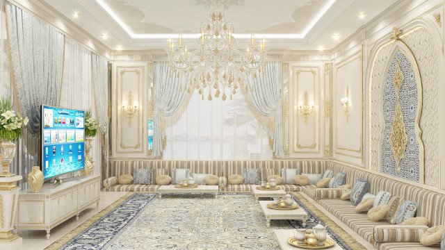 A contemporary bedroom decorated with white furnishings, luxury seating and furniture, and gold accents.