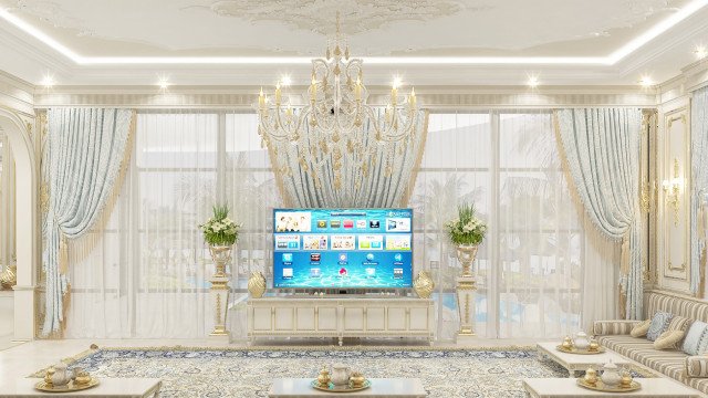 The picture shows a modern luxury living room interior. It has a white marble floor, cream wall paneling, and crystal chandeliers. The room is also furnished with two black velvet couches, a modern coffee table, and a large ornate mirror with an intricate gold frame. There is a Persian rug in the center of the room and two end tables with large white and gold lamps. The overall look is sophisticated and elegant.