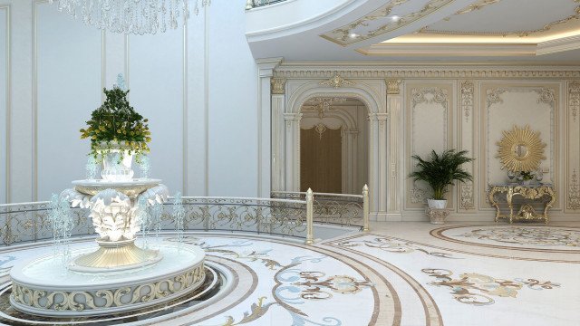 Residential interior decorated in a contemporary style featuring a white, marble-tiled floor, a plush velvet armchair, and an intricately designed chandelier.