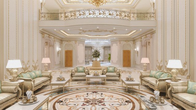 This picture shows the interior of a luxury home designed by Antonovich Design. The space features an impressive marble fountain in the center with walls and floors covered in ornate tiles and other decorative features. The area is surrounded by a large, comfortable seating area with several luxurious armchairs and sofas. In the background, windows fill the room with natural light and offer views of the outside world.
