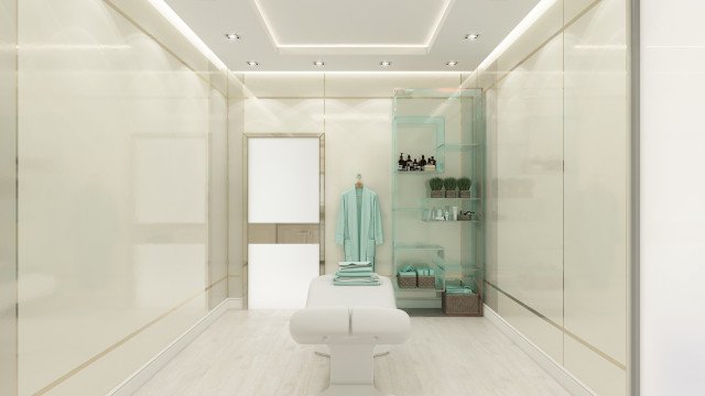 This picture shows a luxurious bathroom interior with a marble countertop and floors. The walls are mirrored and lined with wooden shelves and vanity units. There is a large soaking tub with a curved built-in shower head, and a large window overlooking a garden. On the wall, there is an overhead light fixture, and the vanity units have luxury marble tops.