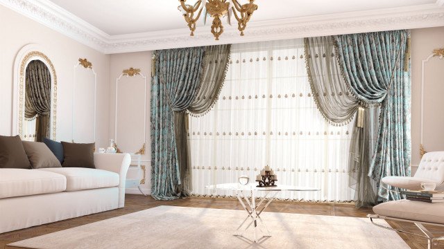 This picture shows an interior design for a luxury living room. It features a two-toned cream and light pink upholstery on a sectional sofa with a matching ottoman and armchair. The walls are painted a light grey and the curtains are white. A chandelier hangs from the ceiling and the floors are covered in a light grey tile. A large mirror is hung on one of the walls, adding to the luxurious feel of the room.