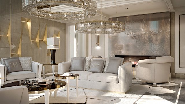 This picture shows a luxurious, modern living room with floor-to-ceiling windows overlooking a breathtaking view. The layout features two comfortable armchairs, a cream-colored sofa, and a large coffee table set against a white marble fireplace. The walls are painted a warm beige color, and the golden accents throughout the decoration add a touch of elegance. The focal point of the room is the large chandelier suspended from the ceiling, providing an exquisite centerpiece for the room.