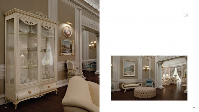 This picture shows an elegant and luxurious bedroom suite in a modern style. The main focus is on a large bed in the center with an ornately designed headboard and footboard. Around this are luxurious pieces of furniture, including an armchair and table set, a vanity, and a chaise lounge chair. The walls are painted a deep blue and feature golden accents, creating an overall sophisticated and opulent atmosphere.