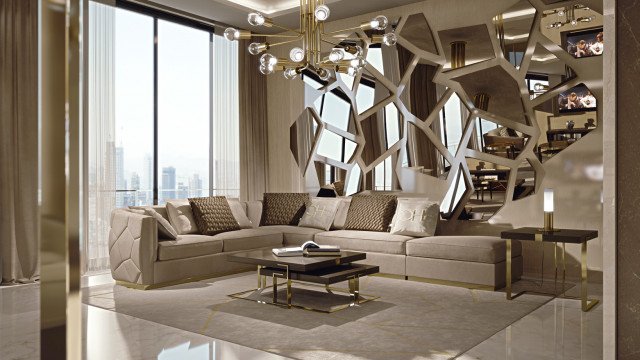 This picture shows a luxurious living room with high ceilings and marble flooring. There is an eye-catching crystal chandelier hanging from the ceiling, while several pieces of elegant furniture are arranged around the room in a symmetrical layout. On one side there is a classic white sofa and armchair set, next to a beautiful cupboard with gold trim. On the other side, a marble coffee table with a matching ottoman sits in front of a stylish fireplace, with a large ornate mirror above. The decor includes various tasteful sculptures and paintings that add to the luxurious ambience