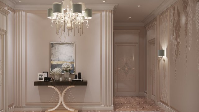 The picture shows a luxurious white and gold interior hallway with beautiful marble floors, walls, and ceiling. The hallway features a gilded mirror and two tall doors on either side with intricate scroll designs. In the center of the hall is an elegant crystal chandelier hanging from the ceiling. At the end of the hallway is a set of steps leading up to an archway entrance.