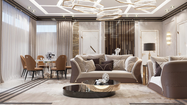 This picture shows an elegant, two-story lobby of a luxury hotel. The interior features rich, contrasting colors and luxurious accents that include a grand marble staircase, cascading chandeliers, plush sofas, and opulent wallpapers and art. There are also metal accents such as the ornate gold archway and light fixtures, and lush plants, which give warmth to the space.