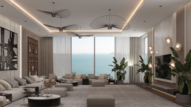 A modern living room featuring cream-colored walls, a marble fireplace, and a large dark wood coffee table.