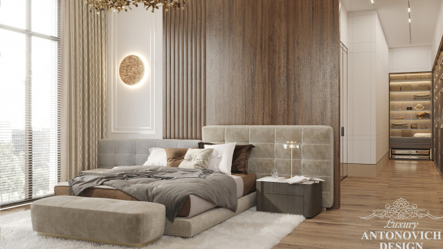 Modern interior with a beige and brown color palette, featuring an elaborate ceiling design, a comfortable seating area, and accentuated walls.