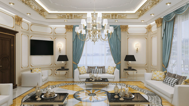 This picture shows a modern living room featuring a curved sofa, a large round coffee table, and various pieces of artwork on the walls. The room is illuminated by a large chandelier, and a set of French doors lead out onto a balcony. The walls are painted a creamy white, and the floor is covered in a light beige carpet.