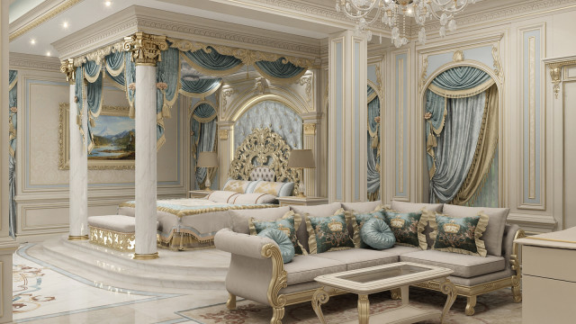 The picture shows a luxurious living room with a huge white L-shaped sofa, set against the backdrop of floor-to-ceiling windows, showcasing a stunning outdoor view. The room is decorated in neutral tones with a grand crystal chandelier overhead, wooden flooring and a large glass coffee table with a white marble top. There are patterned armchairs and a white fur rug adding texture and warmth to the overall design.