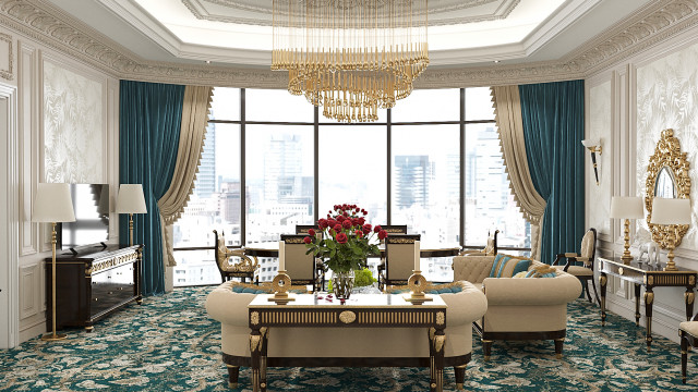 This picture shows an interior design of an elegant, contemporary living room. It features a light blue velvet sofa with silver throw pillows, a white shag rug, a round marble coffee table, and ornate mirrored wall art. The walls are painted a light grey, and the furniture and accents are all tastefully coordinated to create a luxurious and inviting atmosphere.