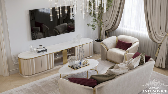 This picture shows a rendered image of an elegant contemporary living room. The space is flooded with natural light and has a luxurious white color palette that creates a bright, airy atmosphere. The room features an L-shaped sectional sofa and armchair, set against an accent wall decorated with an abstract art piece and two modern-style sconces. The white and beige rug grounds the seating area, while the marble coffee table adds an extra touch of refinement. Finally, the large glass doors open up to a stunning outdoor balcony, offering beautiful views of the outside world.