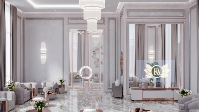 A large, luxurious interior room featuring a marble fireplace and ornate furniture centered around a grand chandelier.