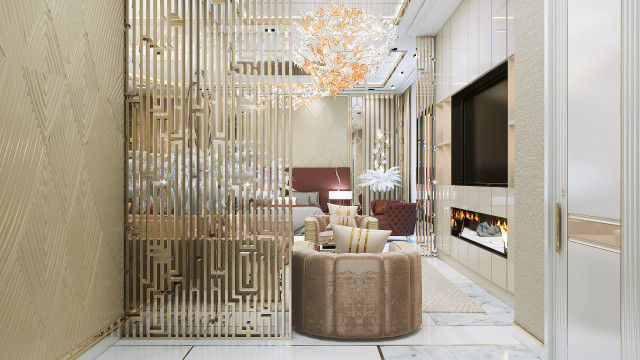 This picture shows a modern luxury master bedroom. It has a sumptuous king size bed with black upholstery and minimalistic metal trim. There are two accent chairs in the corner of the room, and a large crystal chandelier in the center of the ceiling. The walls have a soft gray color and the floor is covered in a dark wood laminate. Windows line one side of the room and allow plenty of natural light to enter.