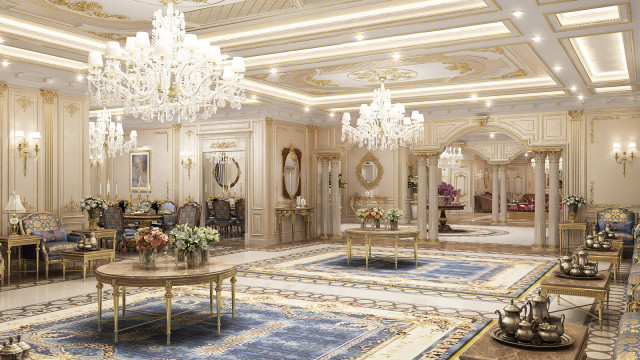 This picture is of a luxurious living room design. It features plush white sofas, an ornate crystal chandelier, a statement mirror, and a marble floor. The walls are painted in a light neutral color and the room is filled with natural light coming through the large windows. The overall atmosphere is warm and inviting.