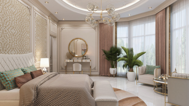 This picture is a modern interior design in a luxury hotel. It features a brown sofa with cream pillows and a round glass coffee table in the center of the room. There is a floor to ceiling window overlooking a cityscape backdrop and a white rug covering the hardwood floors. The walls are painted a light beige color, with gold accents to add a touch of sophistication. The lighting is kept low and warm to create a cozy, yet sophisticated atmosphere.
