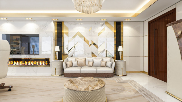 This picture shows the interior of a luxurious bedroom designed by Antonovich Design. The room features a large four-poster bed dressed in white linens and adorned with burgundy throw pillows and runners. An off-white armchair sits in the corner of the room, and a grand white marble fireplace sits atop a stone patterned floor. The walls are painted a warm shade of beige and a large crystal chandelier hangs from the ceiling. Gold accents, such as the lamps and accent pieces, bring a sense of richness to the space.