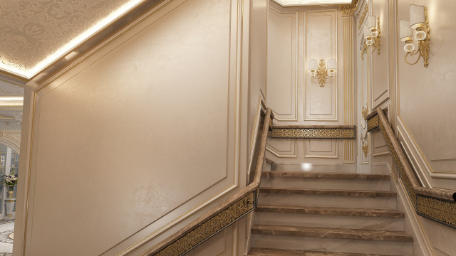 This picture shows a grand lobby with luxurious modern and traditional decor. The space is filled with light coming in from large windows and skylights, and is decorated with white marble floor tiles, an ornate chandelier, and rich velvet furnishings. The sweeping staircase with an intricate balustrade at the center helps create an impressive, dramatic atmosphere.