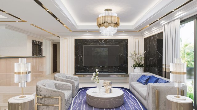 This picture shows a luxurious modern interior design of a living room. It has a black leather sectional sofa with matching ottomans, a round marble side table, and a stack of white grey throw cushions. There is also a round black coffee table with a marble top, and a white area rug with a geometric pattern. A large gold framed mirror adds a glamorous accent to the space and creates the illusion of more space.