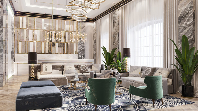 This is a photo of a modern apartment designed by Antonovich Design. It features an open-concept design with an ivory, marble tiled floor, white walls and ceiling with ornate gold accents, and contemporary furniture pieces placed throughout the living spaces. The focal point is the luxurious sofa seating area located in the center of the room, around which various pieces of artwork and decor are placed. A glass-front bar and large kitchen island can be seen in the background.