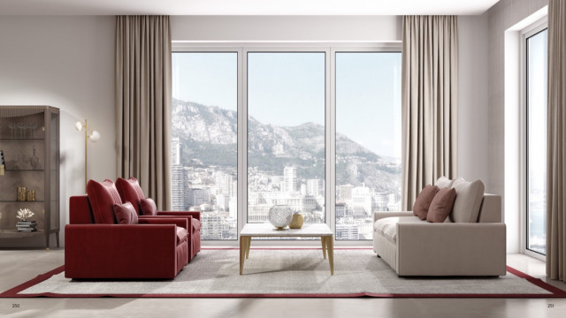 This picture shows an elegantly decorated and furnished living room with a vibrant and modern interior design. The colors are mostly neutral, with bright pops of color from the yellow armchair and the red and orange decorative pillows. The soft cream colored walls contrast nicely with the dark hardwood flooring. A white sofa is situated in front of a large window, allowing for natural light to flood the room. An ornate glass coffee table and a few small side tables provide additional seating options.