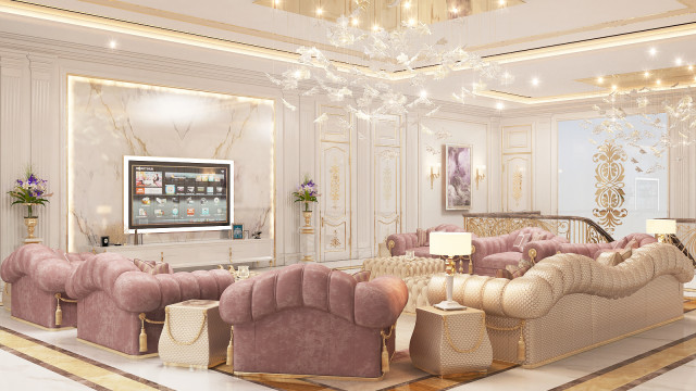 The picture is a rendering of an interior design by Antonovich Design. It features a modern living room with contemporary style furniture and decor. A white leather sectional sofa takes up most of the room, with a glass-top coffee table in the center. To one side are a couple of armchairs, while a feature wall behind supports a mounted television set. The walls have been painted in a light silver hue and finished off with ornate wood trim on the baseboards. The floors are covered in patterned cream-colored carpet, and a statement rug lies under the coffee table. Floor
