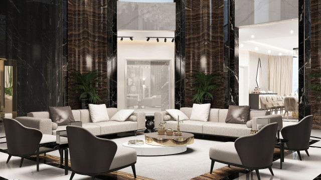 Modern interior design with luxurious furnishings, including a sofa and two armchairs upholstered in white fabric, an intricately patterned rug, and an ornately carved marble coffee table.