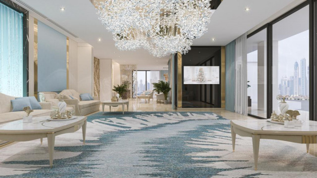 Modern luxury apartment with marble and gold elements, a white classic sofa, and a unique custom chandelier.