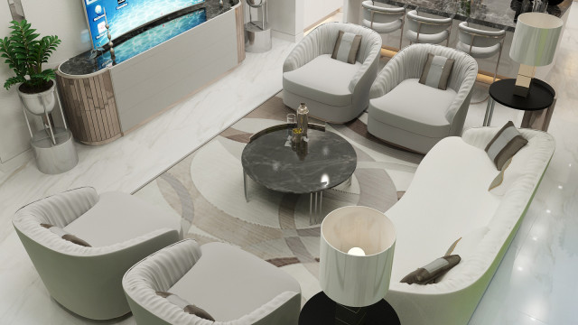 Modern luxury living room with white and grey color palette, featuring a large sofa, armchairs and center table with decorative accessories.