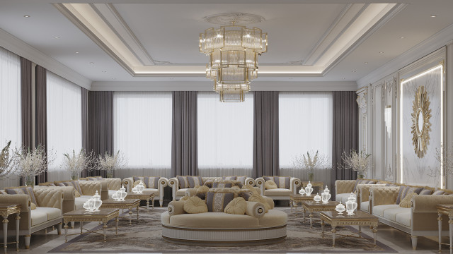 This image shows a living room interior designed by Antonovich Design. The image features a luxurious living room with a large, white sofa, two armchairs in black upholstery, and a glass and metal coffee table in between them. The room also includes a large beige rug, white side tables, and a crystal chandelier. The walls are painted in a light shade of grey, and the floor is covered in laminate wood.