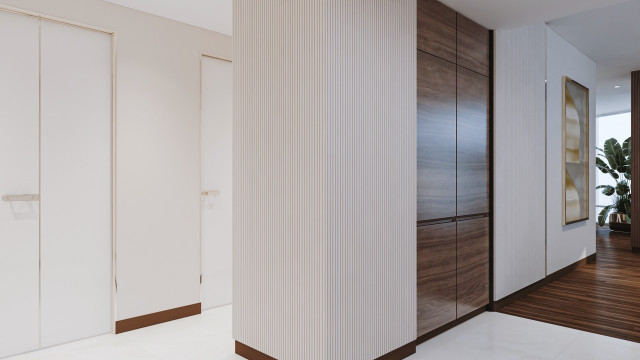 Wooden cabinetry and marble countertop, featuring decorative worktop trim and mosaic tile backsplash.