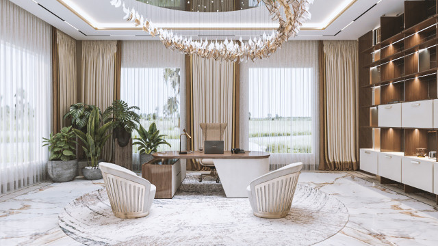 This picture shows an elegant and luxurious foyer in a home designed by Antonovich Design. The walls are a pale yellow and the floor is covered in a neutral-colored marble tile. The room is filled with classic furniture pieces such as a tufted sofa, tufted armchairs, a baroque chandelier, and an ornately carved side table. A large mirror hangs on one wall, further emphasizing the sophisticated atmosphere.