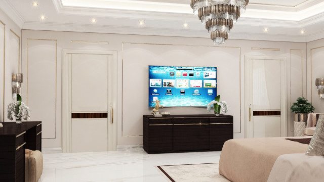 This picture shows a luxurious modern living room. It features walls covered in gray textured wallpaper, white trim and crown molding, a black and white patterned area rug, and a beige sofa set centered on the rug. The walls are adorned with two abstract paintings in black frames, a floor lamp, and subtle accessories, such as a blue vase and a wooden bowl. Large windows let in plenty of natural light, and the room is finished off with wood flooring.