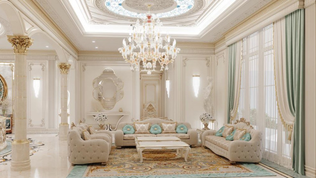 This picture shows a modern-style living room with a curved white sofa with two armchairs set up in the center of the room. The walls are painted in a light gray and accentuated with black frames and artwork above the sofa. A light wood coffee table is placed in front of the sofa and flanked by an oval glass coffee table. The whole space is illuminated by stylish LED lamps on both sides of the sofa.