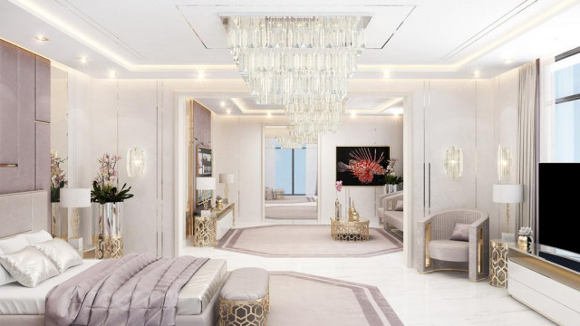 Room featuring steel gray walls and marble floor, with a fireplace and two white armchairs.