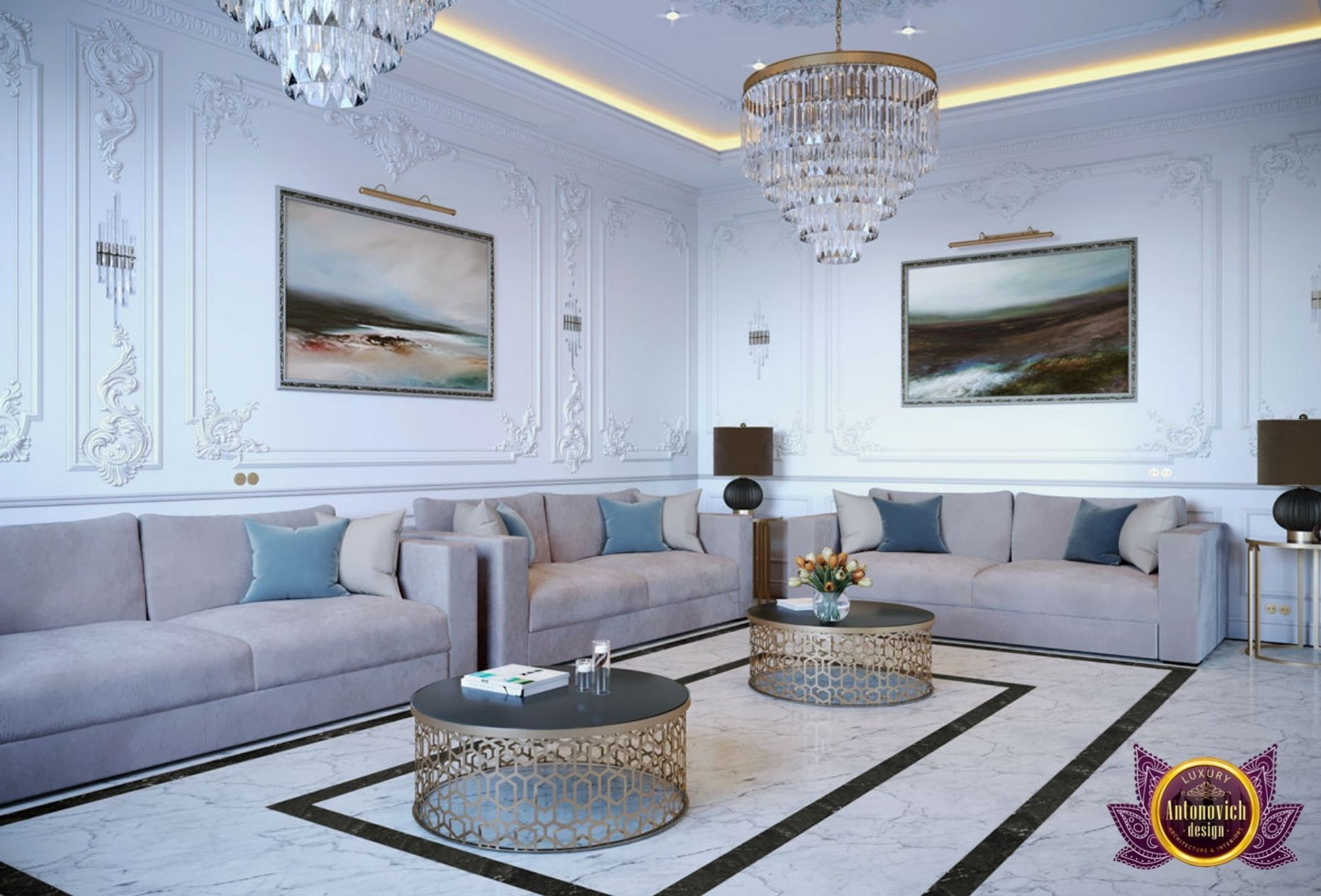 This picture shows a luxury living room designed by Antonovich Design. The room boasts opulent decor and furniture, with a large gold chandelier hanging from the ceiling, cream colored sofas and armchairs, and marble accents throughout. The walls are adorned with intricate patterned wallpaper and there is a plush grey rug covering the floor.