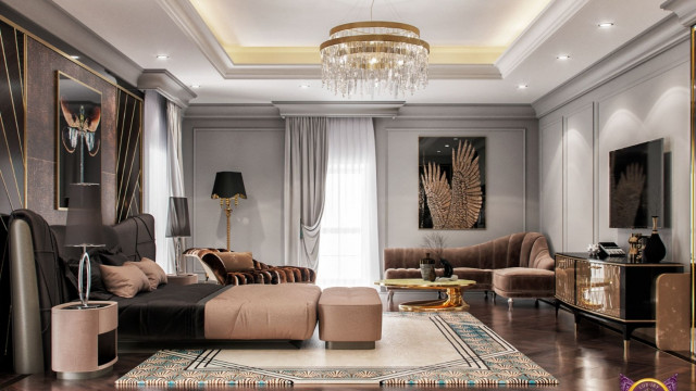This picture shows a luxurious white and gold living room with a curved cream leather sofa, two armchairs, and an area rug that has floral designs. There is an ornate crystal chandelier above the seating area, and floor-to-ceiling curtains frame the space. The walls are paneled in white with a scalloped design, and there is a gilded mirror hanging on the wall.