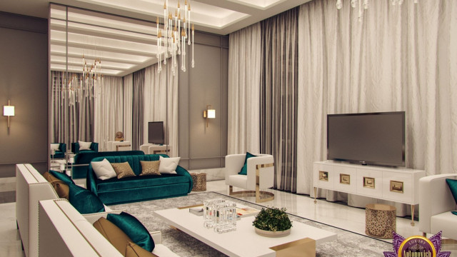 This picture shows a stylish and luxurious living room with contemporary furniture and decor. The walls are painted in a light gray shade and the floor is covered in an elegant gray and white striped carpet. A black velvet sofa sits in the center of the room, surrounded by two white armchairs, a modern-looking crystal chandelier hangs from the ceiling, and a large mirror hangs above the sofa to create visual depth. There are several pieces of art hung on the walls, including a framed abstract painting and some small sculptures. A round glass coffee table completes the look.