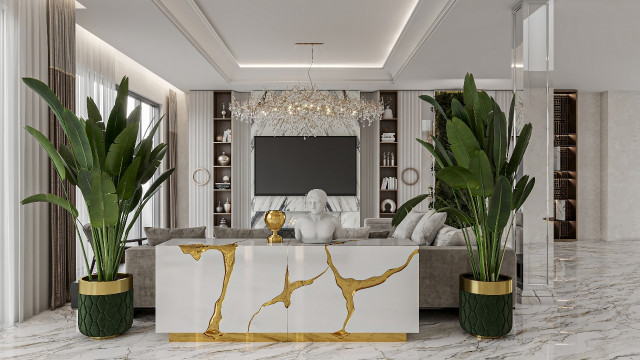 This picture shows a luxurious living room designed with a modern aesthetic. The room features white walls, marble flooring, and a sleek fireplace surrounded by comfortable sofas and chairs. On the back wall is an extravagant chandelier suspended from the ceiling, while the front of the room features a beautiful grand piano, artwork, and shelving. The overall ambiance is one of luxury and sophistication.
