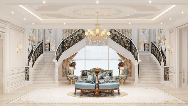 Modern interior with ornate gold columns framing grey walls, a white marbled floor and furniture, and a large chandelier.