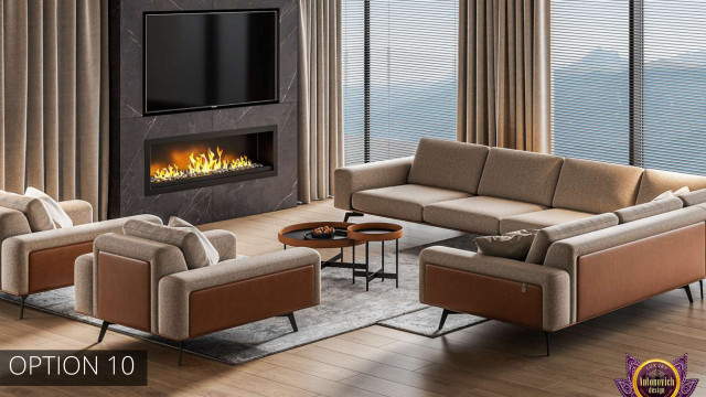 This picture shows a large, luxurious living room with cream walls, a white ceiling, and a dark hardwood floor. There is a white fireplace with a decorative mirror above it and two leather armchairs adjacent to the fireplace. The furniture in the space is supplemented with a beige sofa, an ornate glass coffee table, and several plush pillows. The space is completed with large, lush potted plants and an abstract wall-hanging.