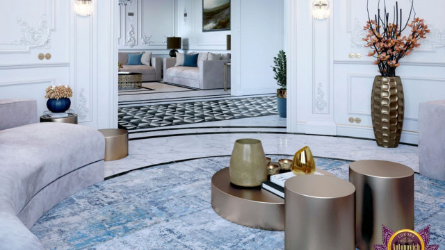 A grand luxury interior featuring a white and gold theme. Ornate furniture and decorative items are placed throughout the room atop detailed flooring.
