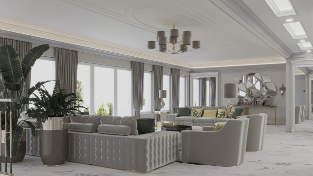 This picture shows a luxurious living room, with a comfortable ivory sectional sofa and light gray armchairs. The walls have warm beige tones, and there is a beautiful round coffee table in the middle of the room. The room also has a white marble fireplace with a decorative mantel as a focal point, and a chic crystal chandelier hanging above.