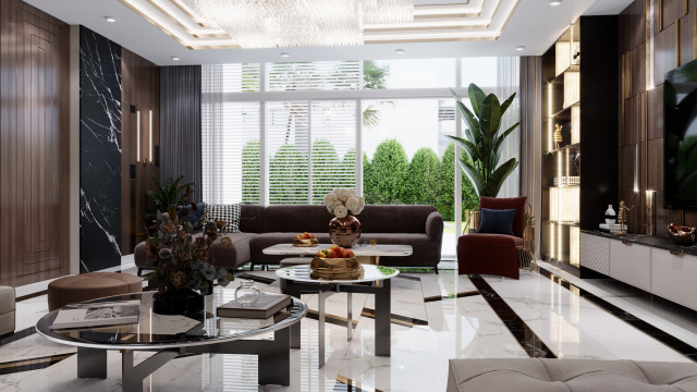 This picture is of a grand, luxurious living room designed by Antonovich Design. The room features a golden-tiled floor with a custom-made white and gold leather couch featuring tufted detailing in the center. The walls are adorned with a white and pale pink color scheme, and golden accents. The furniture includes a white coffee table, a large chandelier, and a light grey armchair. The windows are covered with floor-to-ceiling white sheer curtains and are framed by more golden accents. There is also an ornate gold-framed mirror placed above the
