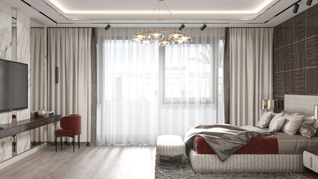 Luxurious hallway featuring elegant parquet flooring, symmetrical arches on either side, and a large decorative chandelier.