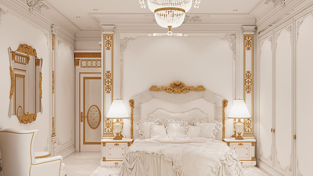 Modern bedroom with luxurious furniture, featuring a king-sized bed with upholstered headboard and footboard in cream-colored fabric, armchair with soft velvet cushion, wooden night stands, and chandelier.
